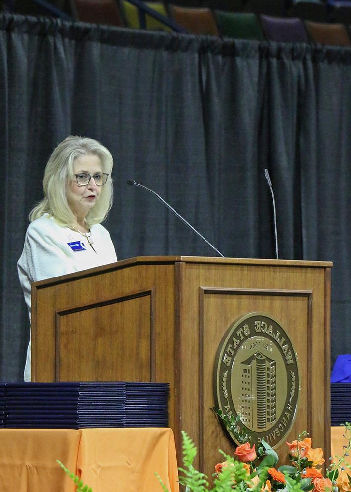 Patti Wilkins, Director of Wallace State’s Adult Education program, welcomes students to the 2024 Graduation ceremony.