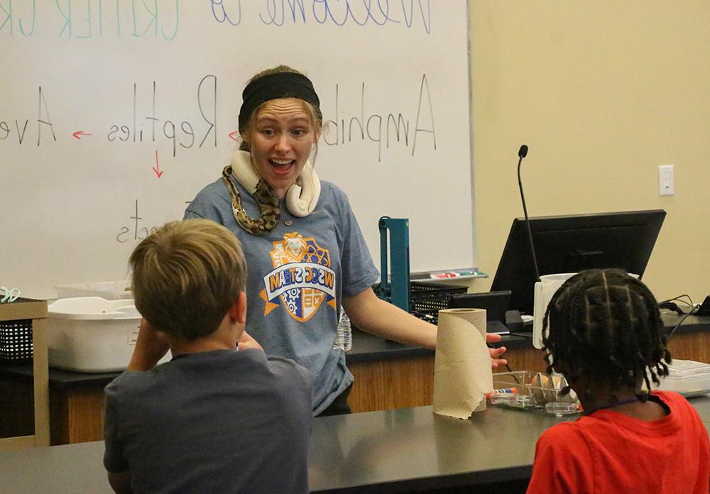 Biology Instructor Cassidy Wright leads "Critter Crew" activity.