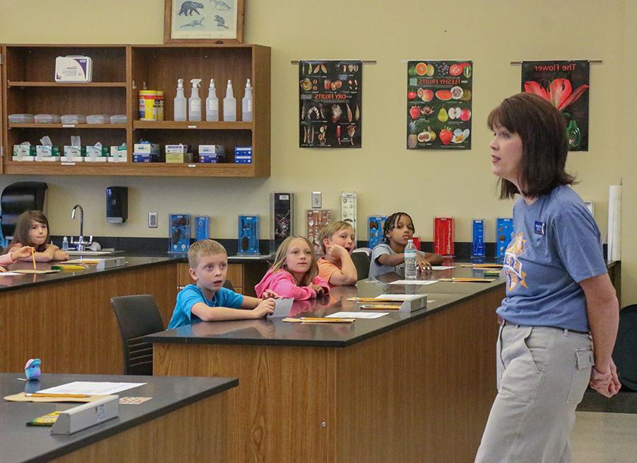 Natural Sciences Department Chair Beth Williams teaches students about genes.